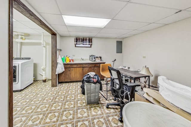 office area featuring a paneled ceiling and washer / dryer