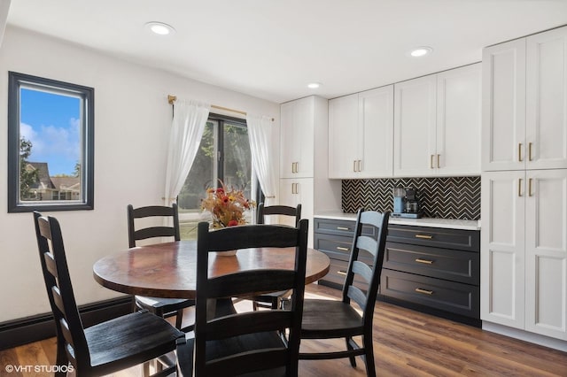 dining area with dark hardwood / wood-style floors