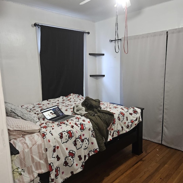 bedroom featuring wood finished floors