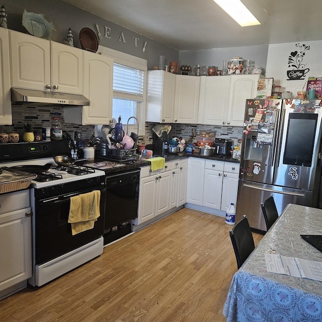 kitchen featuring under cabinet range hood, dishwasher, range with gas stovetop, light wood-style flooring, and stainless steel refrigerator with ice dispenser