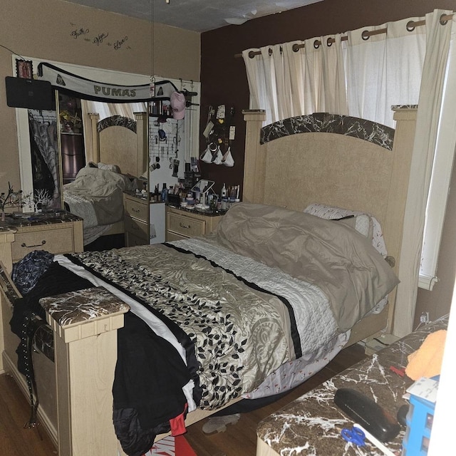 bedroom with wood finished floors