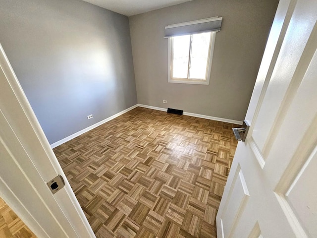 empty room featuring light parquet flooring