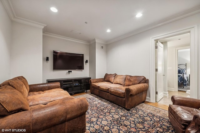 living room with hardwood / wood-style flooring and ornamental molding