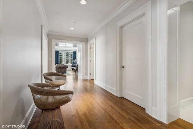 hallway featuring crown molding and dark wood-type flooring