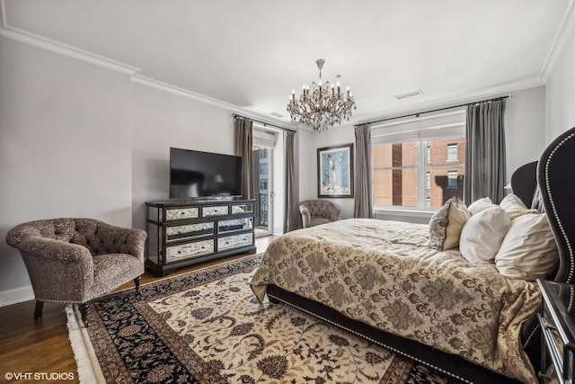 bedroom featuring a notable chandelier, access to exterior, hardwood / wood-style flooring, and ornamental molding