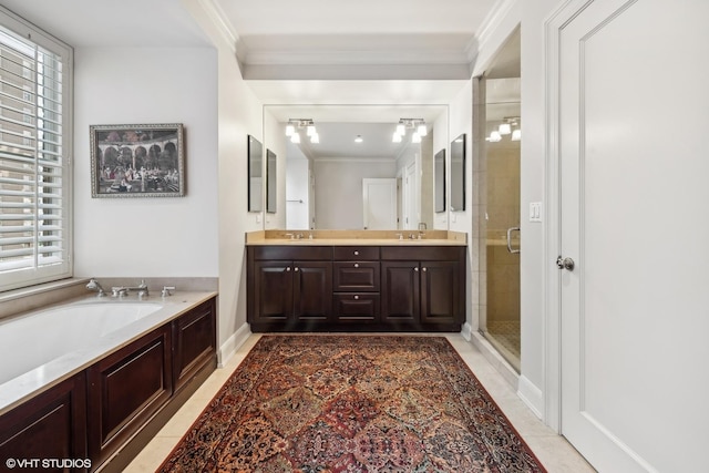 bathroom featuring crown molding, tile patterned floors, vanity, and shower with separate bathtub