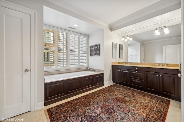 bathroom featuring crown molding, a tub, and vanity