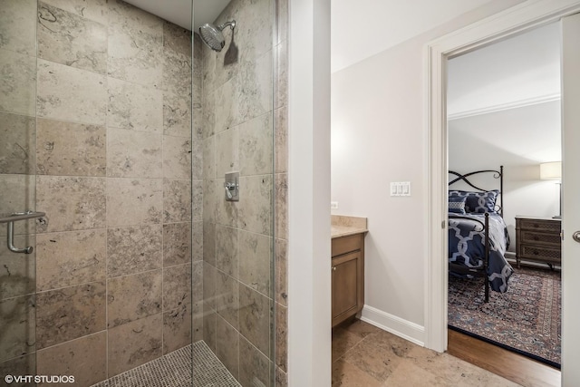 bathroom featuring vanity and an enclosed shower