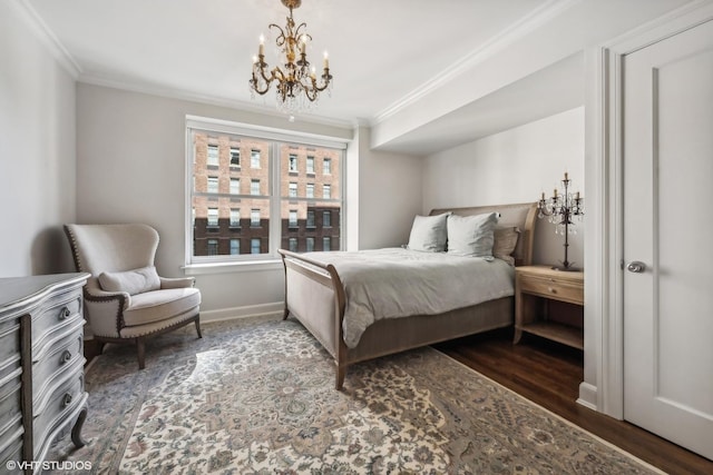 bedroom featuring crown molding, dark hardwood / wood-style floors, and an inviting chandelier