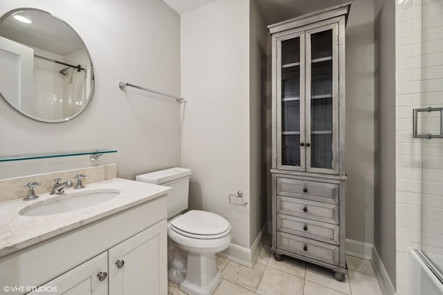 full bathroom with vanity, tile patterned flooring, combined bath / shower with glass door, and toilet