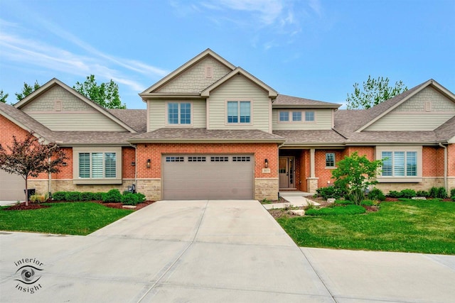 20375 Grosse Point Dr, Frankfort, IL 60423 - view of front of property with concrete driveway, a front yard, a garage, and brick siding