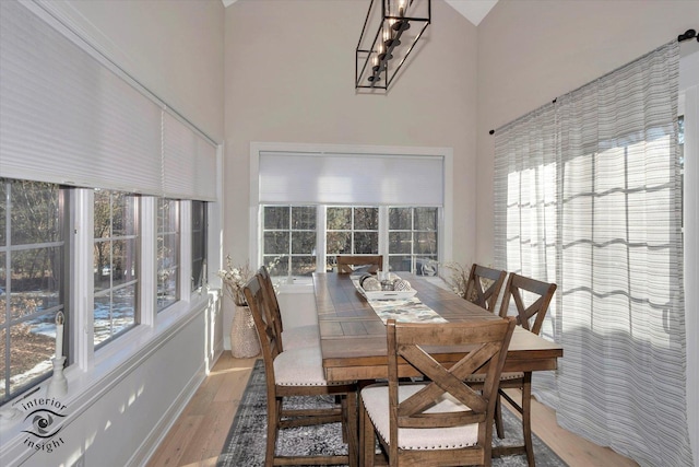 20375 Grosse Point Dr, Frankfort, IL 60423 - dining space featuring a high ceiling, healthy amount of natural light, and wood finished floors