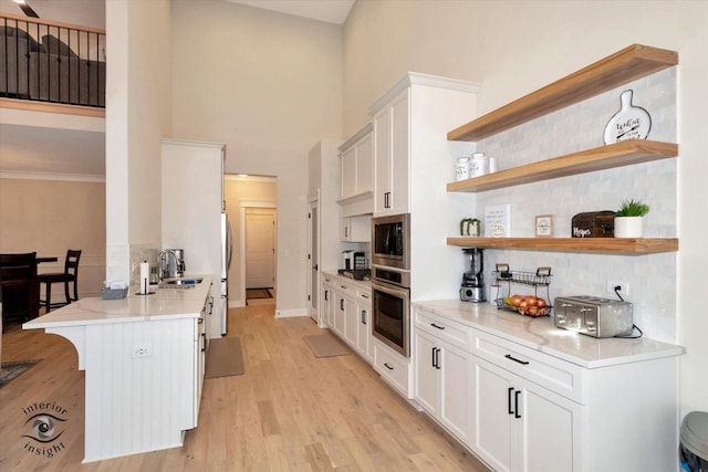 20375 Grosse Point Dr, Frankfort, IL 60423 - kitchen with stainless steel appliances, a sink, open shelves, decorative backsplash, and a towering ceiling