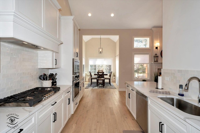 20375 Grosse Point Dr, Frankfort, IL 60423 - kitchen featuring appliances with stainless steel finishes, a sink, white cabinets, backsplash, and light wood-style flooring