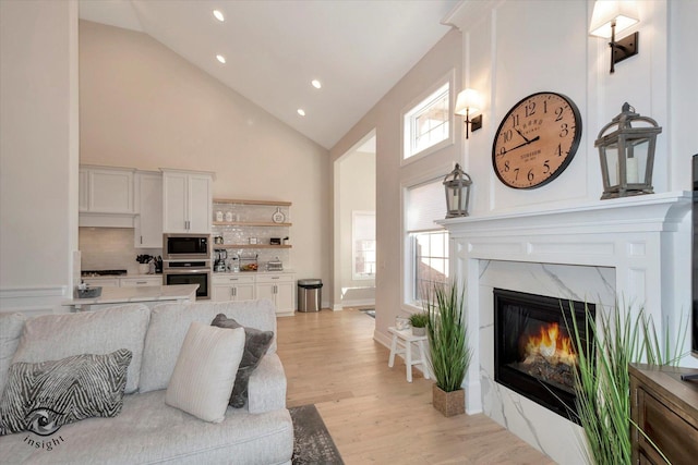20375 Grosse Point Dr, Frankfort, IL 60423 - living room with high vaulted ceiling, recessed lighting, light wood finished floors, and a high end fireplace