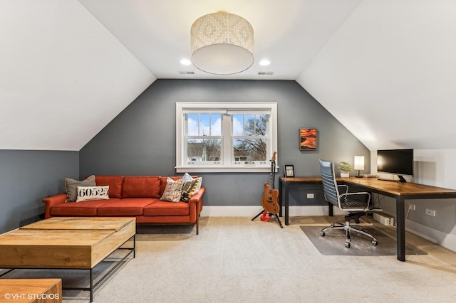 office space featuring lofted ceiling and light carpet