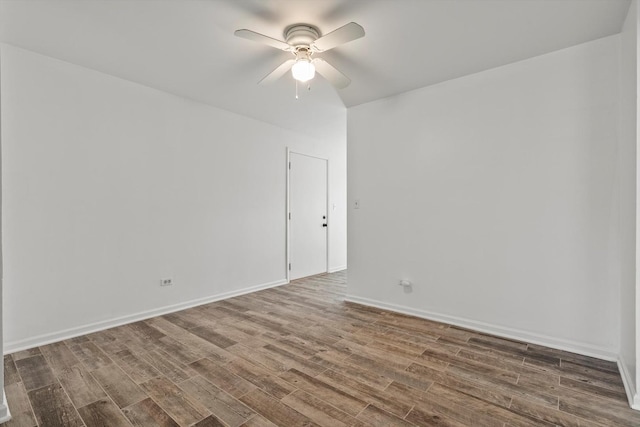 unfurnished room featuring ceiling fan and dark hardwood / wood-style flooring