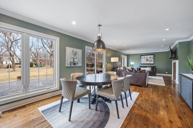 dining space with visible vents, recessed lighting, crown molding, baseboards, and dark wood-style flooring