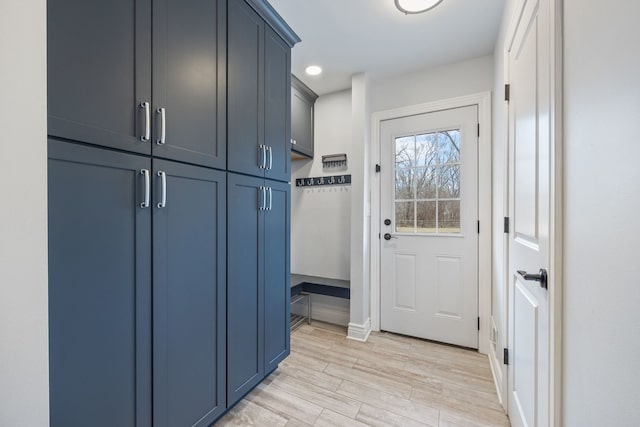 doorway to outside featuring light wood-style floors