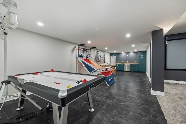 recreation room with recessed lighting and baseboards