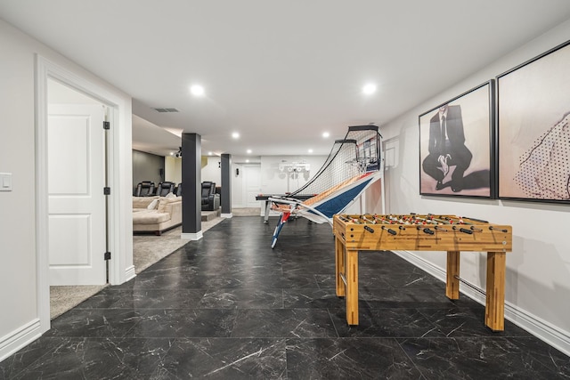 rec room featuring recessed lighting, baseboards, and marble finish floor