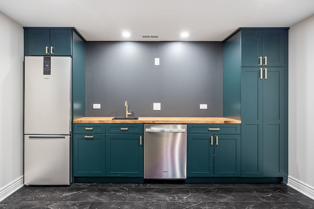 bar featuring visible vents, marble finish floor, dishwasher, and freestanding refrigerator