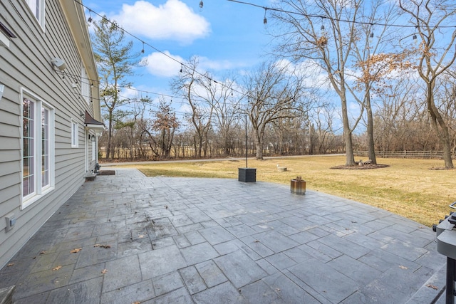 view of patio featuring fence