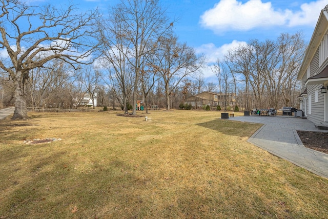 view of yard with a patio and fence