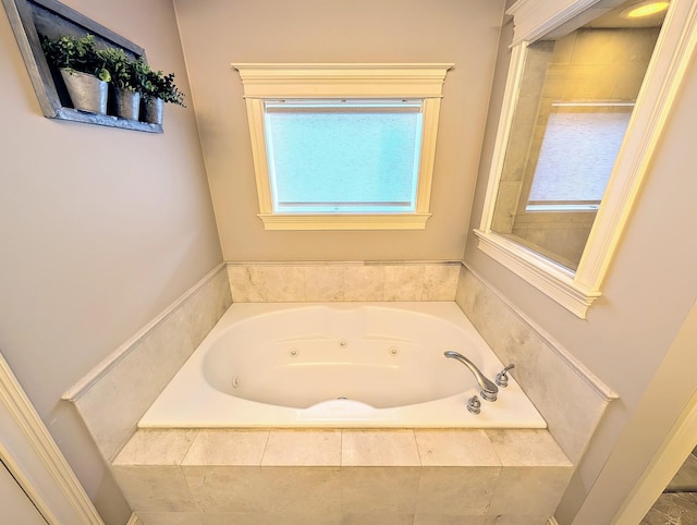 bathroom with a relaxing tiled tub