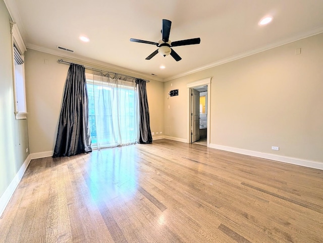 unfurnished room with ornamental molding, light hardwood / wood-style floors, and ceiling fan