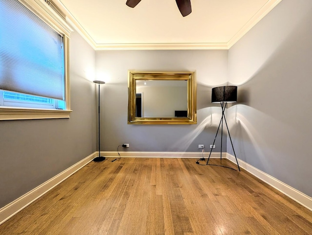 interior space featuring crown molding, ceiling fan, and hardwood / wood-style flooring