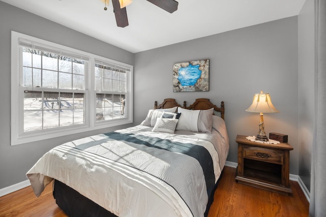 bedroom featuring ceiling fan and wood-type flooring