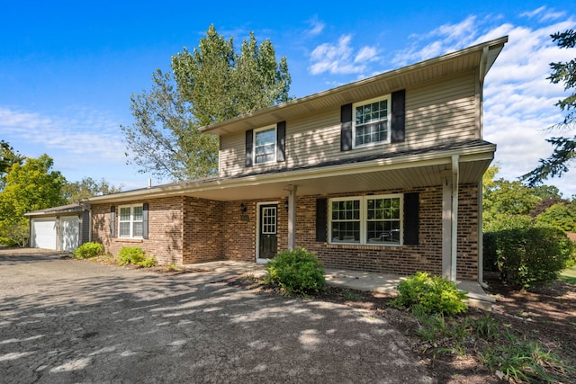 front of property featuring a garage and a porch