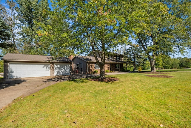 view of front facade with a garage and a front yard