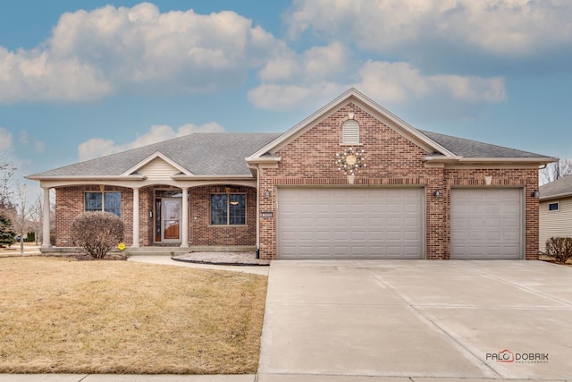 view of front facade featuring a garage and a front lawn