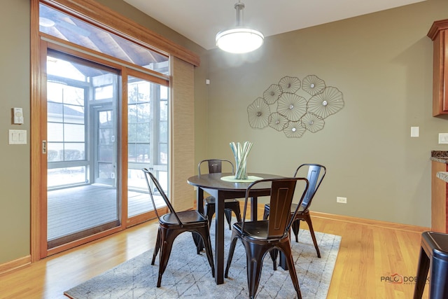 dining room with light wood-type flooring