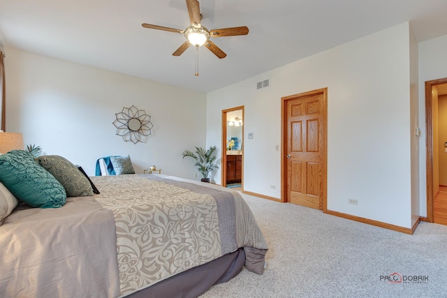 bedroom featuring ensuite bath, ceiling fan, and carpet flooring