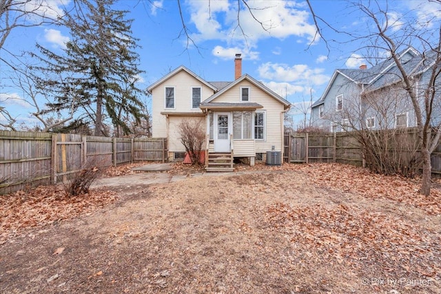 rear view of property featuring cooling unit