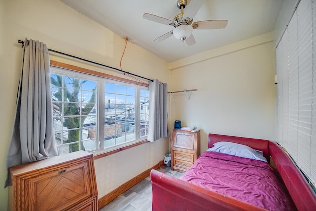 bedroom featuring ceiling fan and light wood-type flooring