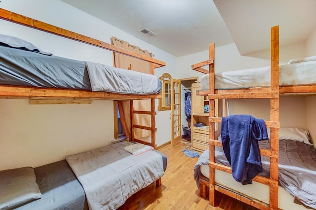 bedroom with light hardwood / wood-style floors