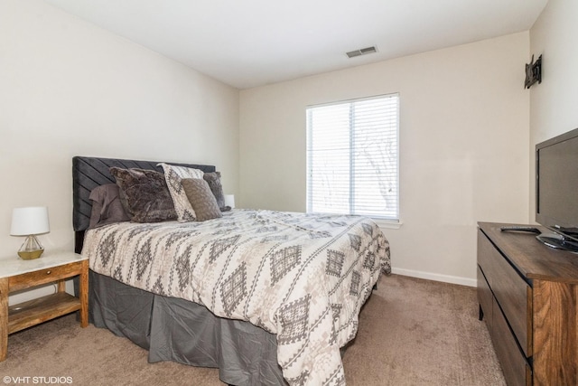 bedroom featuring light colored carpet