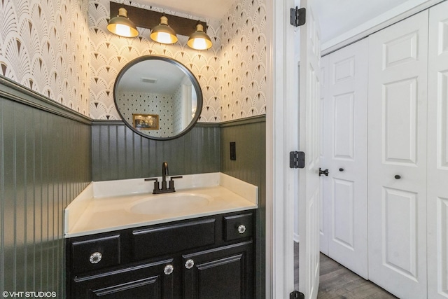 bathroom with vanity and hardwood / wood-style floors