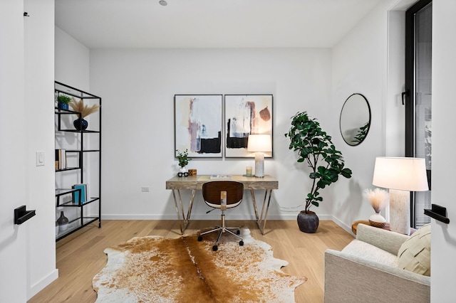 home office featuring light hardwood / wood-style floors