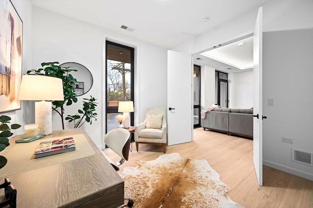 office area with light hardwood / wood-style flooring