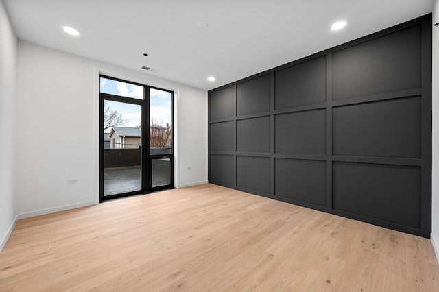 empty room featuring light hardwood / wood-style floors