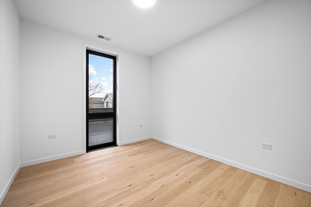 spare room with light wood-type flooring