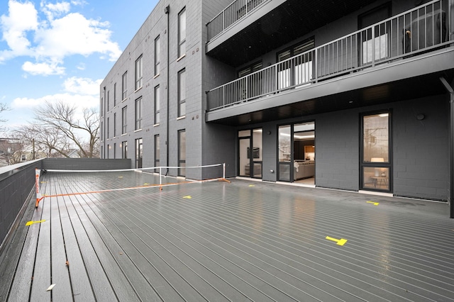 wooden deck featuring volleyball court