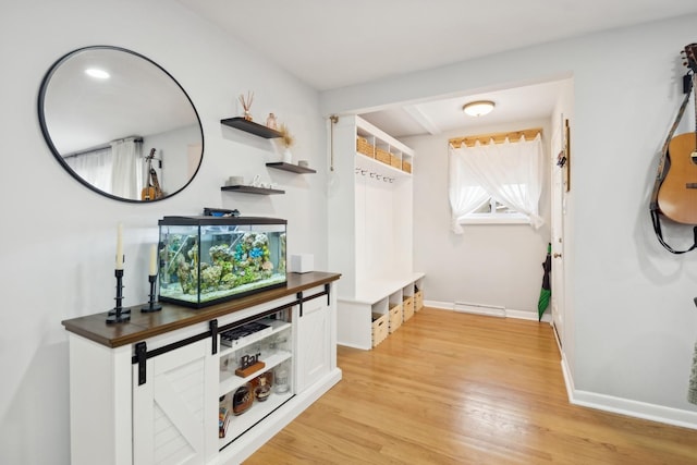 mudroom with light hardwood / wood-style flooring