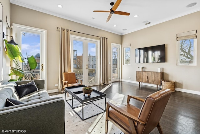 living room featuring ornamental molding, recessed lighting, wood finished floors, and baseboards