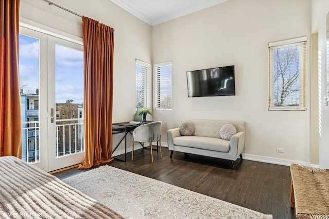 living area featuring ornamental molding, dark wood-style flooring, and baseboards